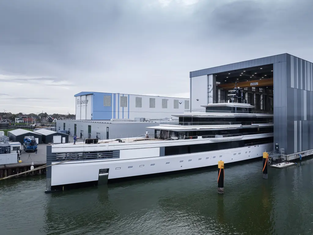 Ulysses partly out of the covered build hall, her upper decks still under the roof