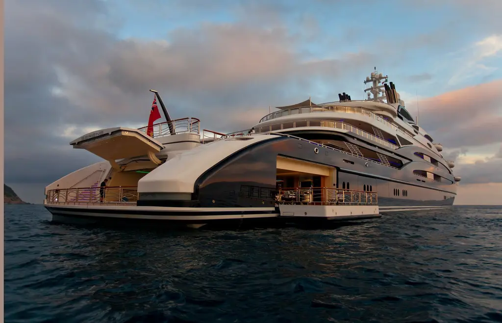 Serene's stern at dusk with the stern and side platforms opened out over the water