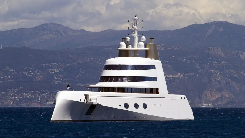 Motor Yacht A from the bow quarter with hills behind