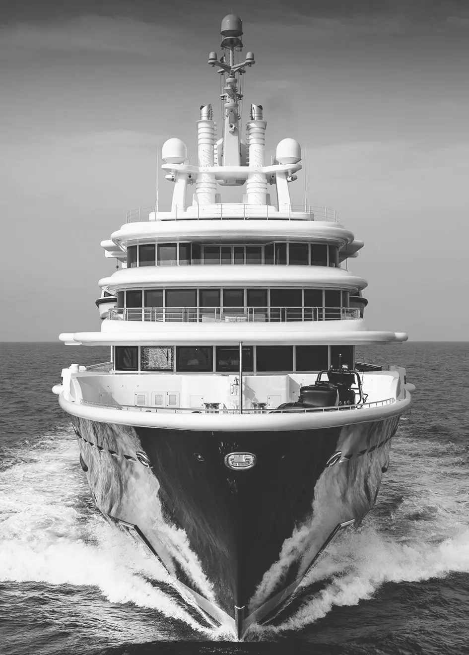 Black-and-white head-on view of Luna's bow cutting through the water