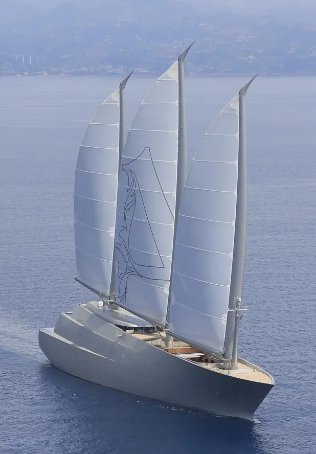 Aerial three-quarter view of Sailing Yacht A from the bow, sailing with all three sails set