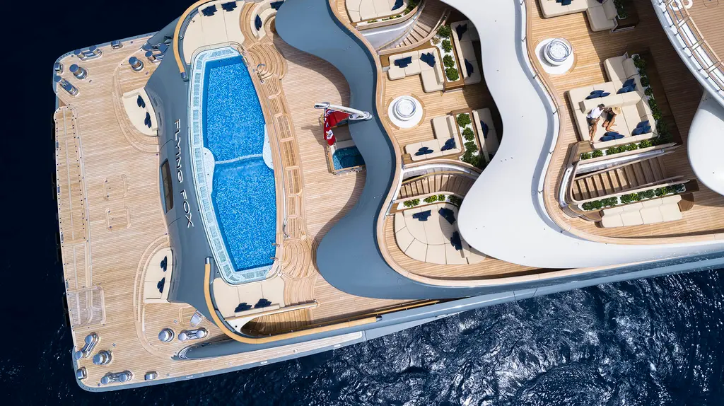 Aerial view of the aft decks with the blue pool across the main deck