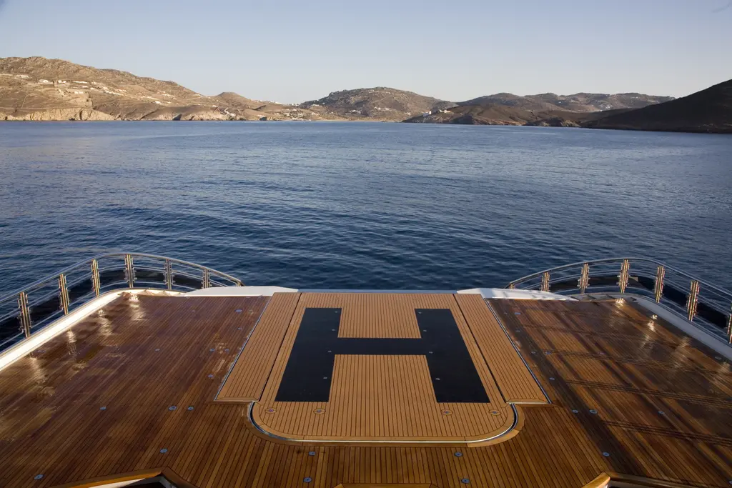 The pool raised flush with the deck and marked with a helicopter H