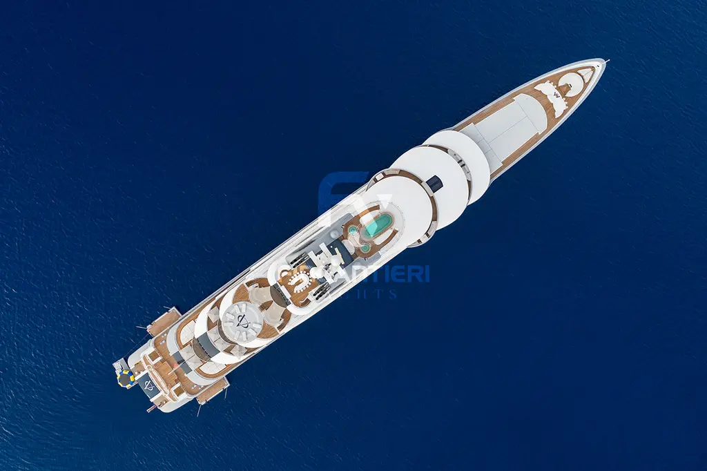 Ocean Victory seen directly from above on dark blue water, showing the round upper decks, a pool and the aft helipad