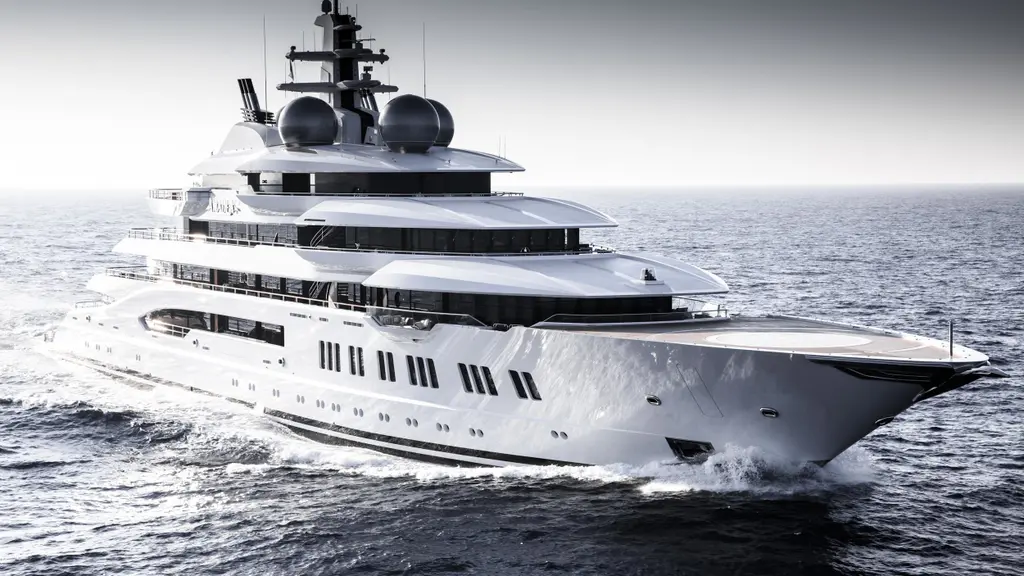 Amadea under way at speed, bow three-quarter view, white hull and silver radar domes