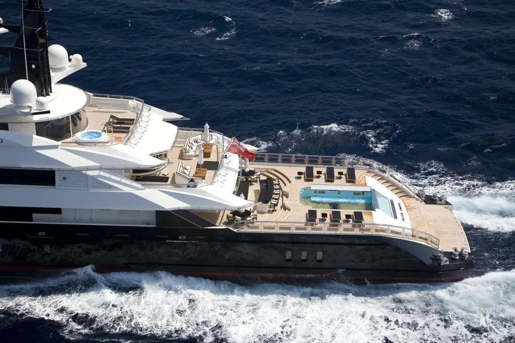 Aerial view of Alfa Nero underway with the aft-deck pool full of water