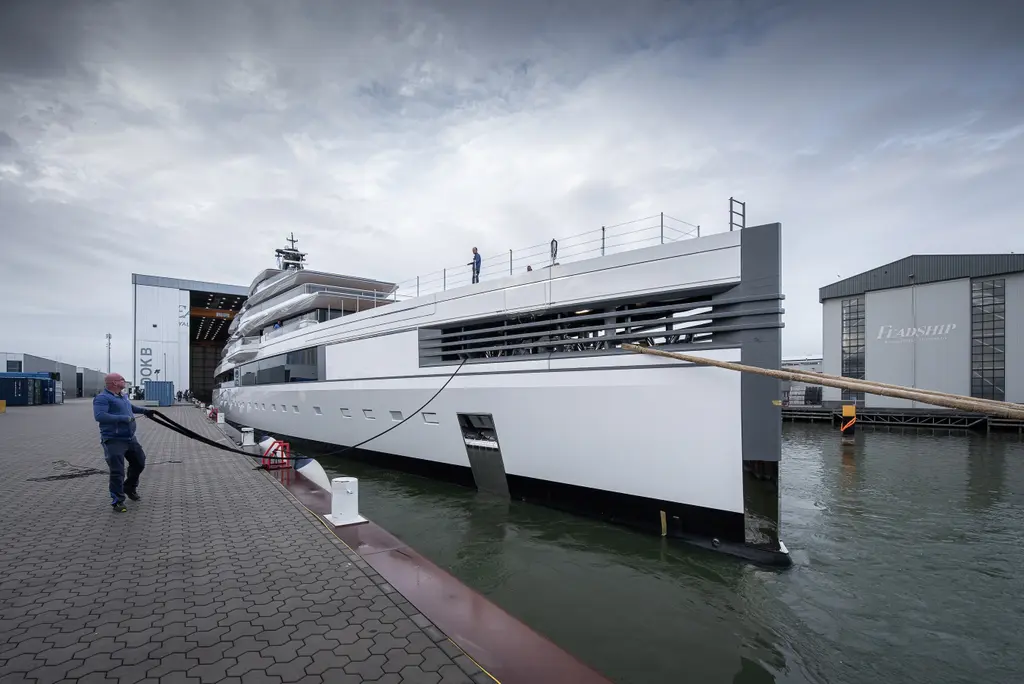 The vertical bow of Ulysses moored at the yard quay, with louvred panels on the foredeck bulwark
