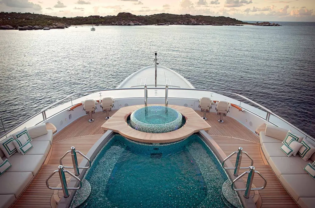 Mosaic-tiled pool on the sun deck with a raised Jacuzzi at its forward end