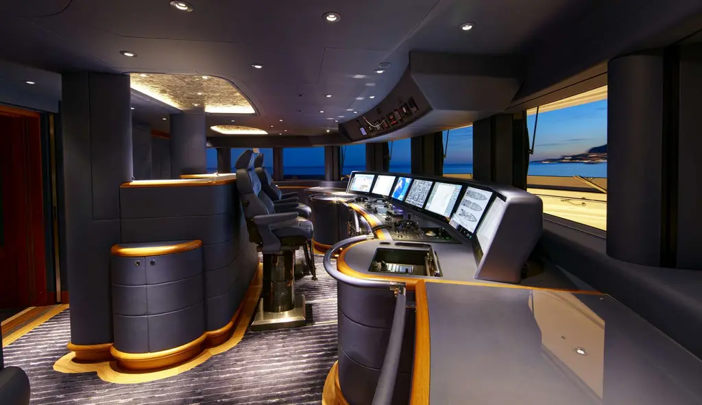 Wheelhouse with helm chairs and a console of navigation screens