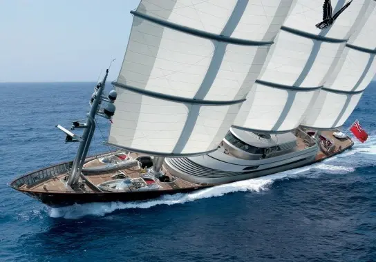 Maltese Falcon heeling under sail, foredeck and mast-top instruments in the foreground