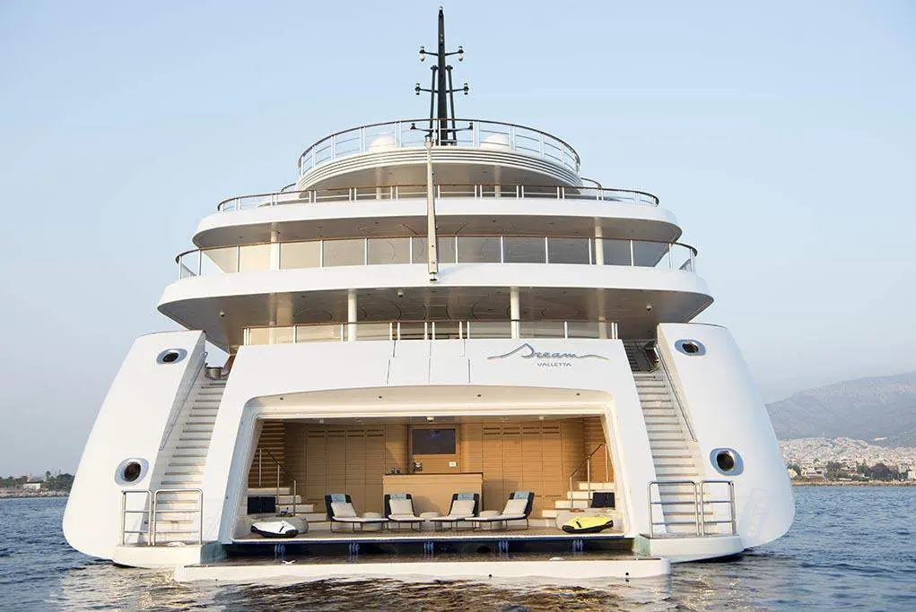 Dream's stern with the large transom door open onto the beach club and twin staircases