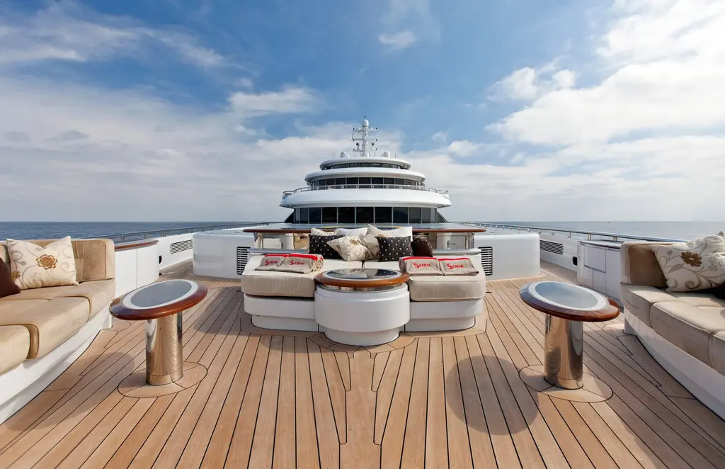 Teak foredeck lounge with sofas facing the bridge of Serene