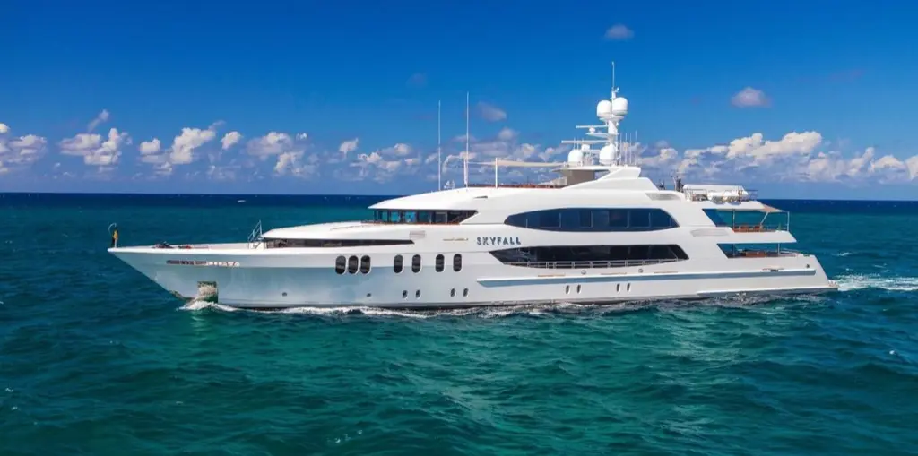 Skyfall underway on turquoise water, full port-side profile
