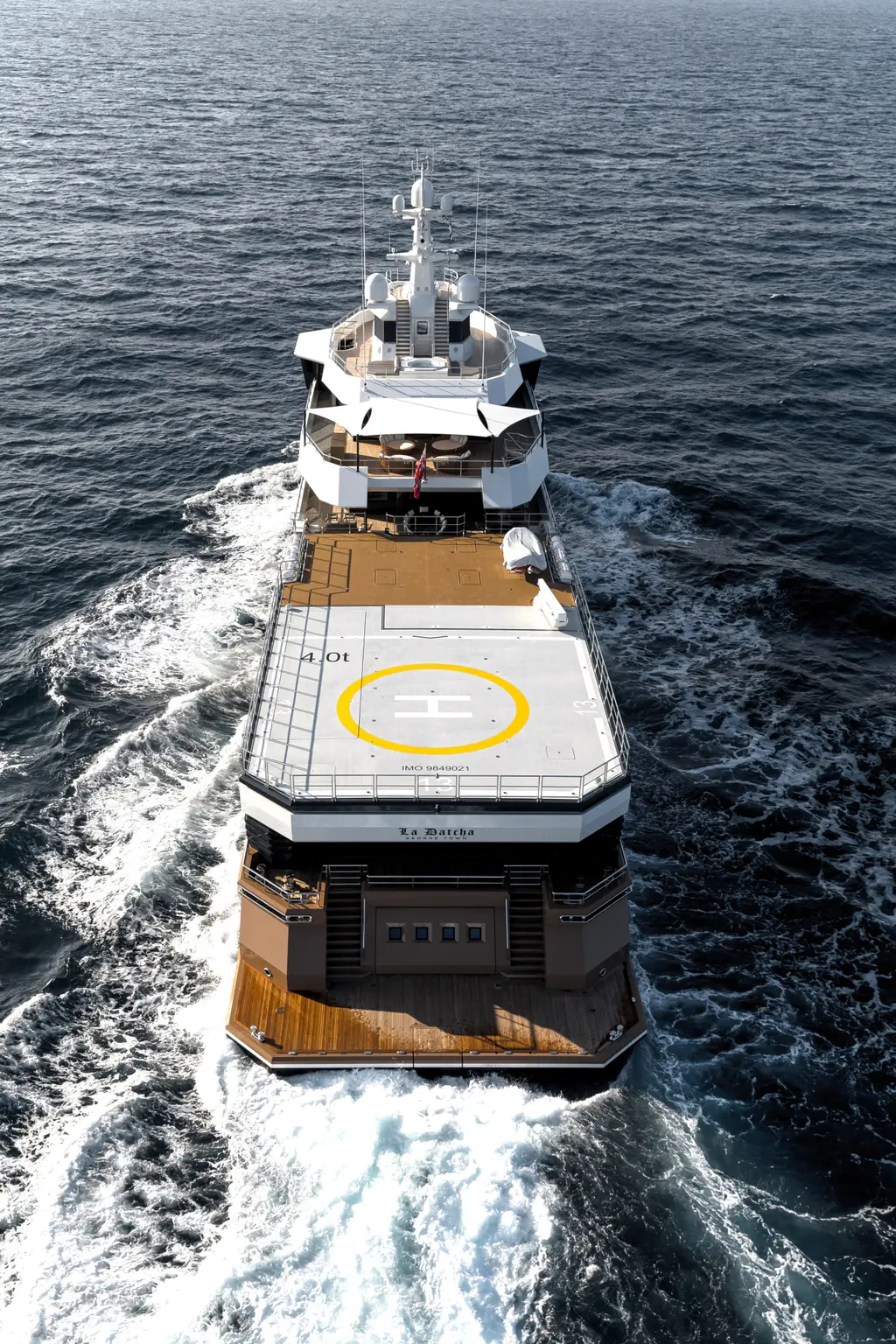 Aerial view from astern of La Datcha with the helipad marked in yellow on the aft deck