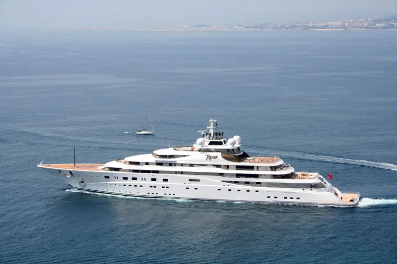 A+ underway in a calm sea, her former name Topaz still on the superstructure