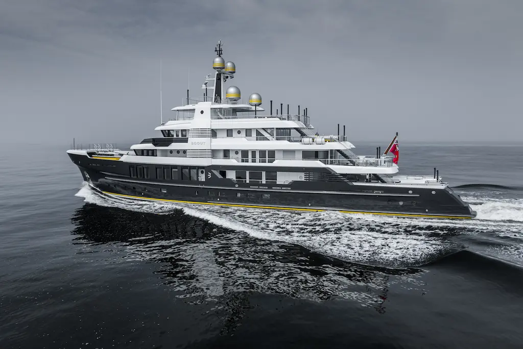 Scout from the port quarter, showing the stepped aft decks and the beach club at the transom