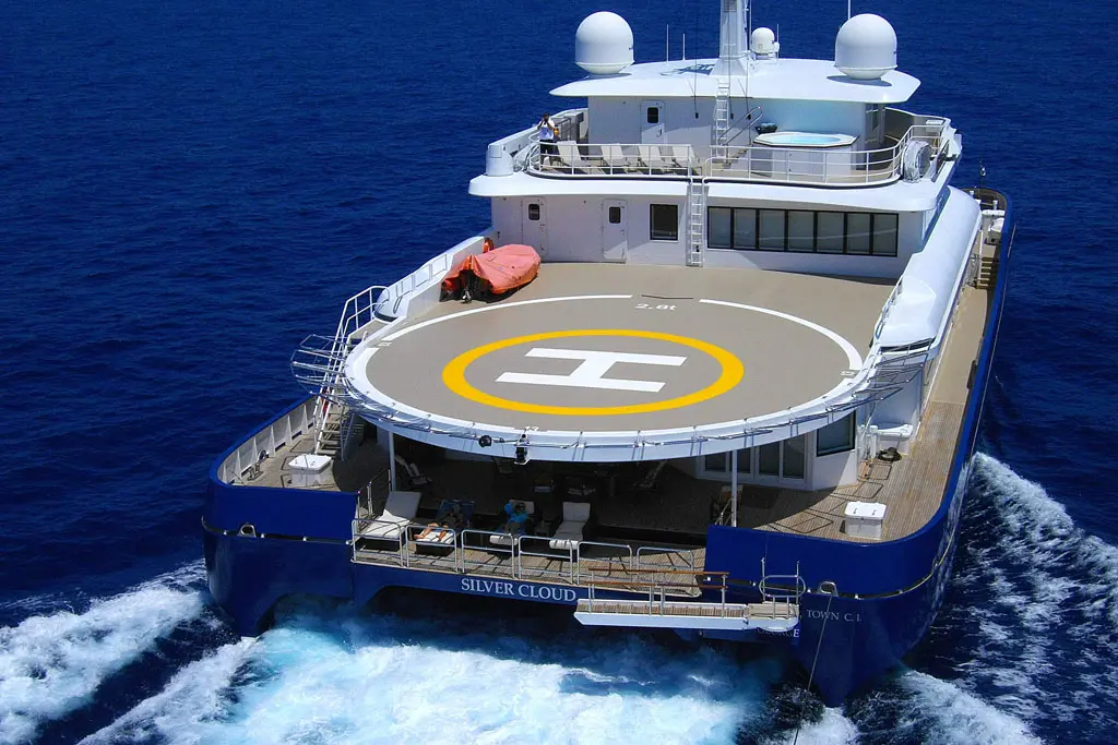 Aerial view of Silver Cloud from astern with the yellow-marked helipad on the upper deck aft