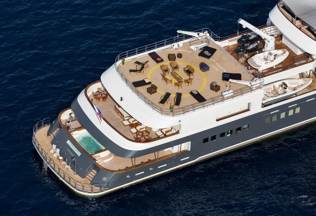 Aerial view of Legend's stern: the round helideck marking on the owner's deck, the spa pool on the main deck aft and the swim platform