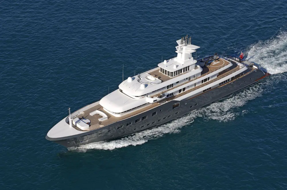 Aerial view of Ice under way with a white wake, showing the long open aft deck behind the superstructure and the foredeck