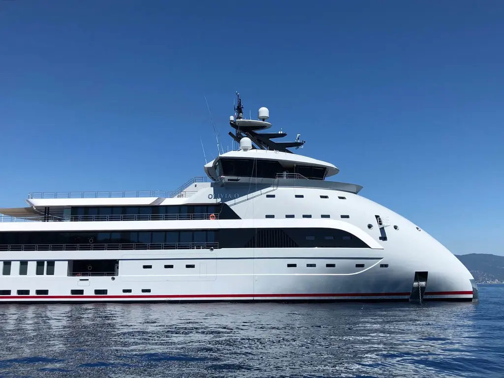 Starboard side of Olivia O close up: the rounded bow, the bridge deck and the stepped decks aft
