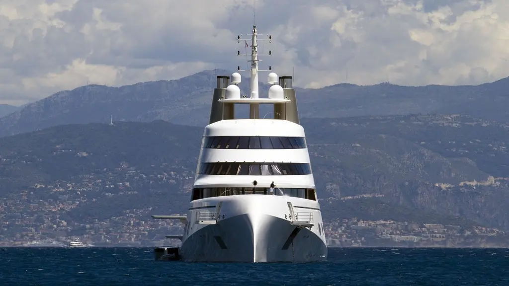 Motor Yacht A seen head-on, the narrow bow below the tiered superstructure and mast