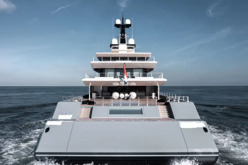 Seven Seas seen from directly astern, with the main-deck pool and the stepped aft decks above the transom