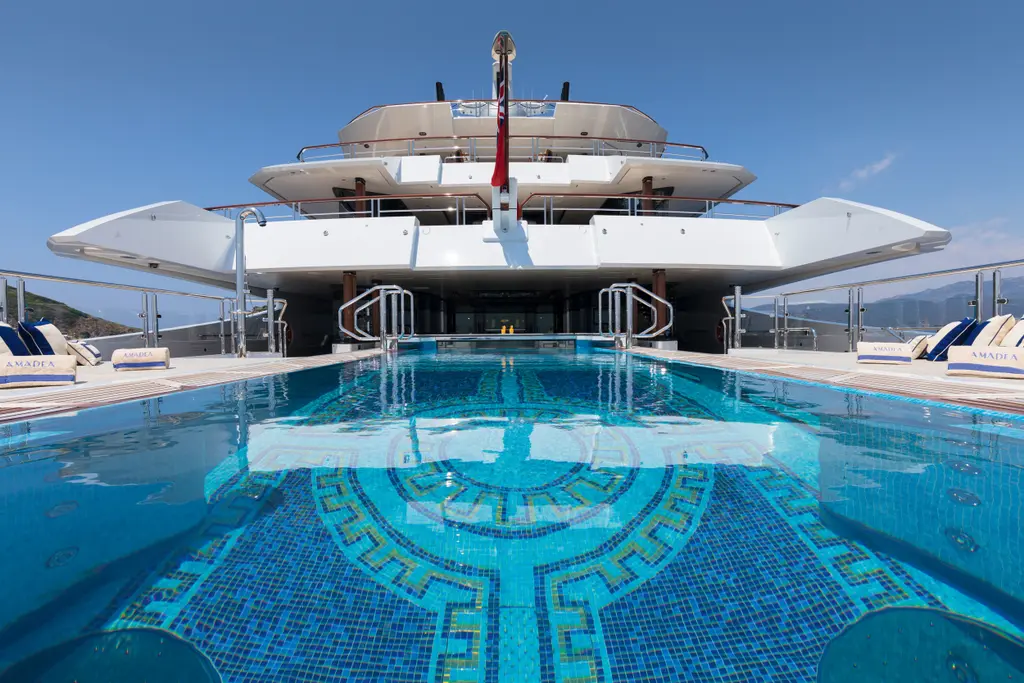 Mosaic infinity pool on Amadea's aft main deck, looking forward
