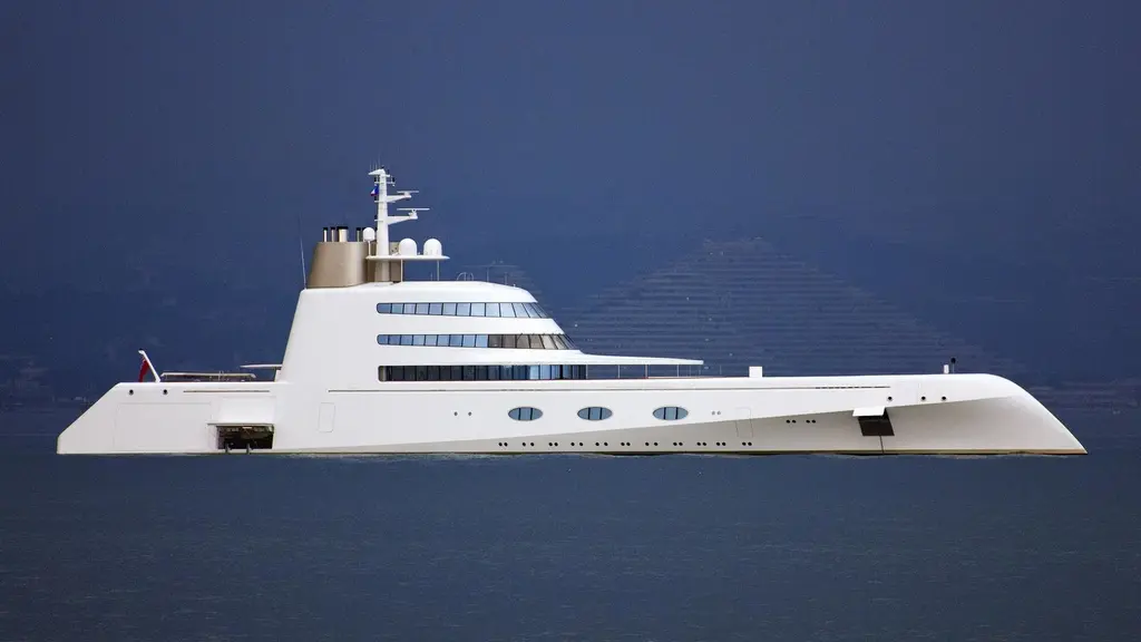 Motor Yacht A in full profile, white hull and stepped superstructure against a dark blue sky