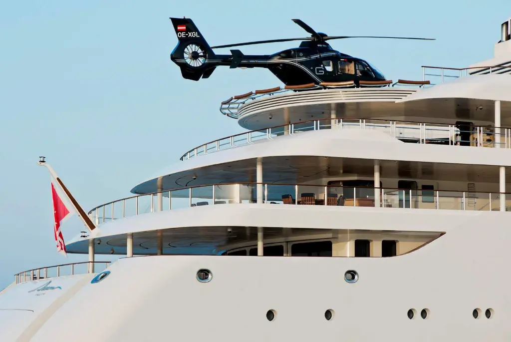 A black helicopter lifting off Dream's upper deck