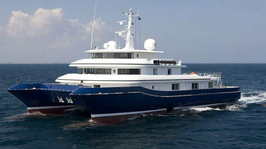 Silver Cloud in profile at sea, bow to the right, showing the long blue hull and stepped white decks
