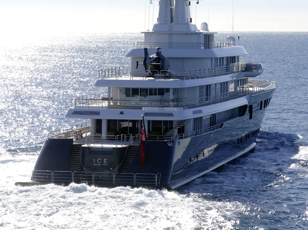 Ice seen from astern on sunlit water, with the name ICE on the transom, the stern platform and the stepped aft decks