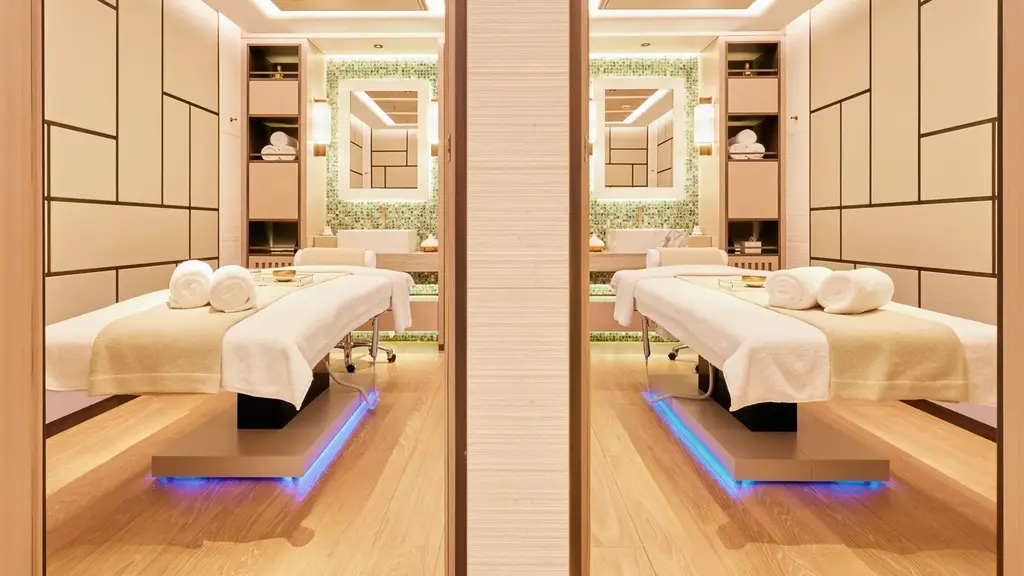 Two treatment rooms side by side, each with a massage table